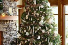 22 a luxurious woodland Christmas tree with white, silver and brown ornaments, owls, vine balls and garlands and icicles