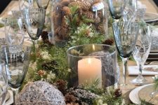 a gorgeous christmas table decor idea with evergreens