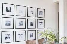 a grid gallery wall with matching black frames and clear space instead of matting and black and white photos