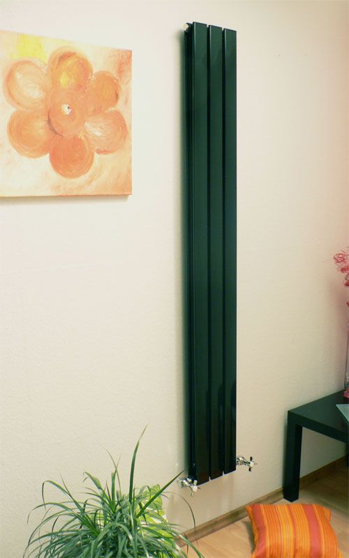 A narrow dark green radiator is a bold and contrasting accent for any interior and it will look very eye catchy