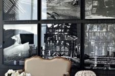 a statement gallery wall with thin black frames that seem invisible due to using black and white art and no matting