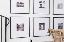 a statement grid gallery wall with matching black frames and black and white artworks with matting is a stylish idea to rock