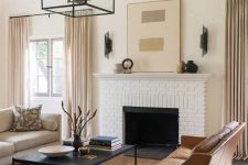 04 an elegant living room done in the sahdes of beige and camel plus black details for depth