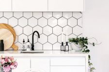 08 a white Scandinavian kitchen with a bit of black touches for a contrast and hex tile sticker panels on the backsplash to make it more awesome