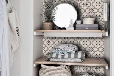 09 a little laundry nook with open shelving styled with tan printed tile stickers to make it more eye-catchy and chic