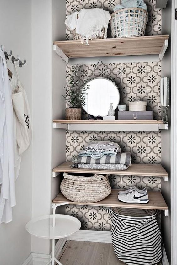 A little laundry nook with open shelving styled with tan printed tile stickers to make it more eye catchy and chic