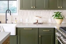 14 a catchy green kitchen with a white tile backsplash and gold touches plus black fixtures is super stylish