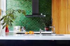 17 a masculine inspired kitchen accented with forest green fish scale tile and white countertops for a contrast
