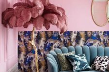 18 this bold and kitschy lamp will make your space jaw-dropping, it’s a gilded branch lamp with dusty pink feathers