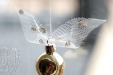 21 such a little Golden Snitch is easy to DIY, just add a bit of tulle to imitate wings and voila, a lovely ornament is ready