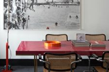 36 a chic space that pairs up a modern red table and vintage rattan chairs to make the look incredibly bold