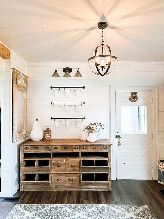 A cabinet made of reclaimed wood is an eco friendly way to repurpose old wood and a lovely farmhouse touch to the space