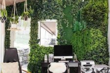 52 a biophilic home office with a greenery wall and potted plants hanging from above looks very fresh