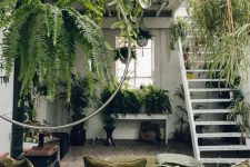 58 a super biophilic space with lots of greenery everywhere and natural fabrics for upholstery – this room looks like jungle