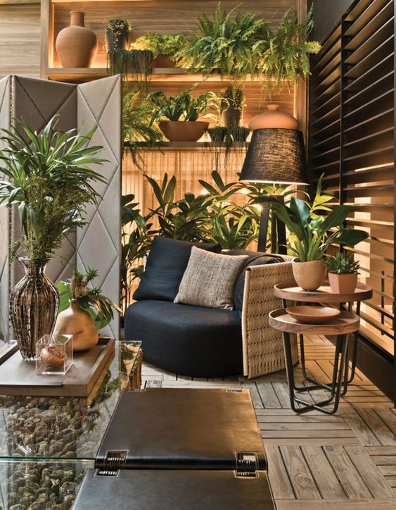 a real home oasis with lots of potted plants and done in natural colors with lots of wood is a lovely idea