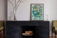 a beautiful fluted black marble surround is a stylish idea for a modern living room, it looks very chic and cool