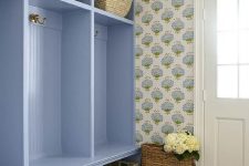 a retro-style entryway with a floral wallpaper
