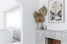 a fireplace with a beautiful marble reeded surround is a stylish addition to a contemporary interior, it looks super chic