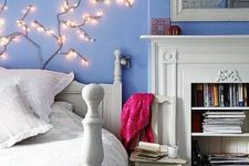 a fireplace with a mantel makes any bedroom cozier