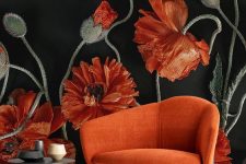 a bold nook with a gorgeous coquelicot flower mural and a matching large chair, a stone side table and chic vases