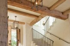 gorgeous rough wooden beams like these ones highlight the age of the mansion and show its vintage beauty and style