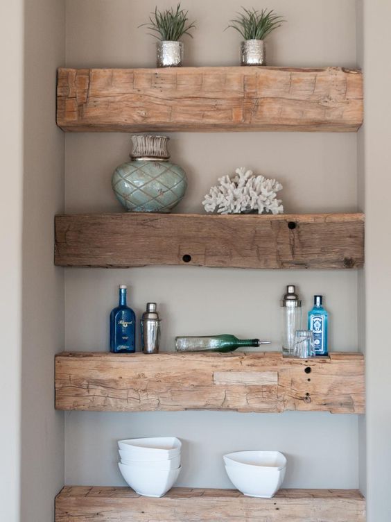 Small built in wooden slab shelves of rough wood are a great idea for your awkward nook or a tiny bathroom or mudroom