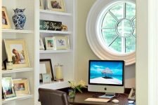 25 an awkward nook with a porthole window, built-in shelves, a built-in desk and a leather chair is a cool productive oasis