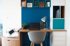 26 a creative curved awkward nook turned into a home office with a navy accent, built-in shelves and a desk plus a small bench with a drawer