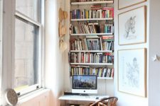 42 a tiny nook by the window with lots of shelves, a desk and a wooden chair, a gallery wall and some lights