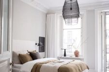 a cozy Scandi bedroom design with lots of moldings