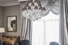 a glam and chic ceiling medallion with an oversized crystal chandelier with taupe lampshades look amazing with each other and add elegance to the room