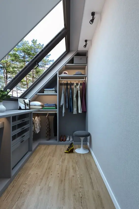 A small and narrow closet with built in open storage units, shelves and drawers is a smart solution for a small home