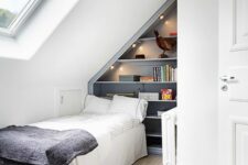 a practical small attic bedroom with a built-in storage unit