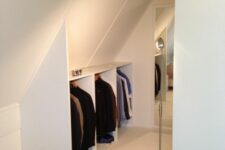 a small attic storage unit built-in and a large storage unit opposite it can become your perfect little closet at once