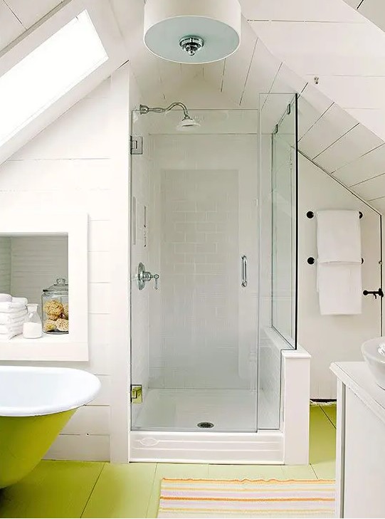 A white attic bathroom with a neon green floor, a shower, a neon green bathtub, a built in niche for storage and a sink