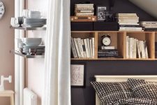 an attic bedroom with smart storage – built-in storage units and shelves for placing books, decor and other stuff