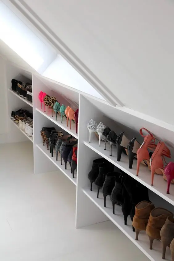 open shoe shelves built into a small attic space will be a great solution for a small closet, this is effective storage at its best