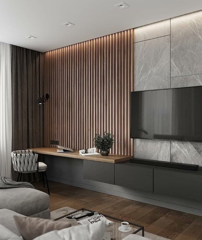 A contemporary monochromatic living room with a wood slat and stone tile accent wall, a floating TV unit with a built in desk and neutral seating furniture