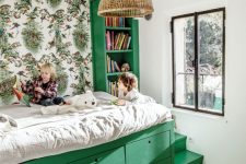 14 a small and bright kids’ room with a green storage bed and a built-in bookshelf, a printed wallpaper wall and a woven pendant lamp