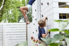 12 a kids’ house in the garden with a climbing wall to let kids play and have fun here in many ways