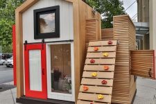 18 a lovely kids’ house with a sliding door, an attic and a climbing wall instead of a usual ladder is a creative way to make your kids move more