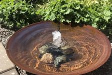 26 a super simple modern bowl fountain with rocks on the bottom is a great water feature for a modern garden, and your pets can refresh themselves in it