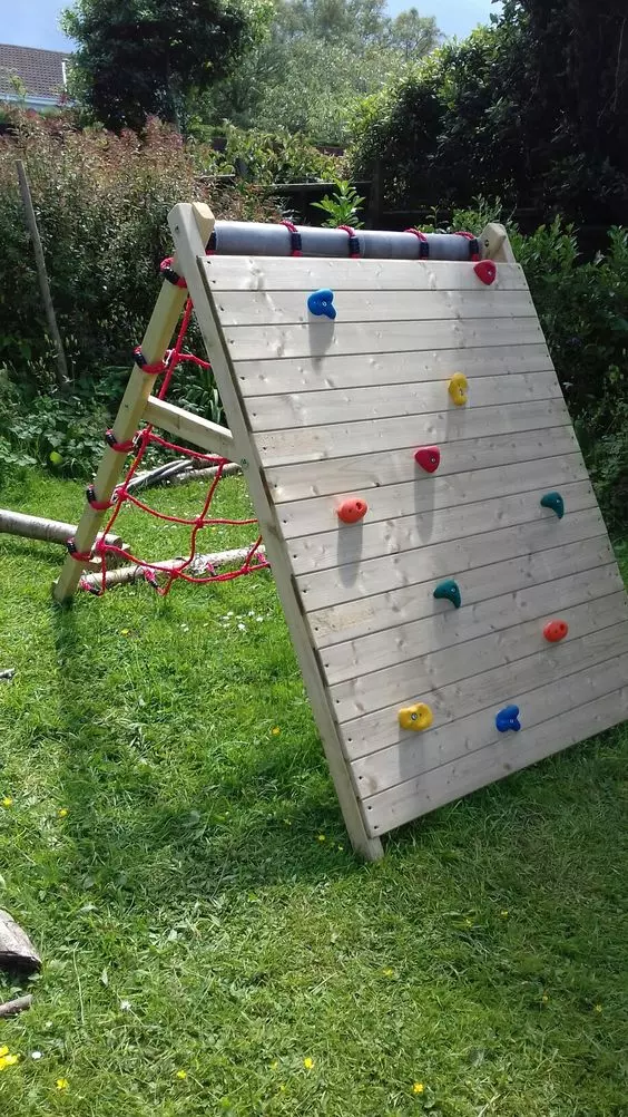 a folding piece featuring a climbing wall and a netting one is a cool and bold idea for a garden and you can remove it anytime