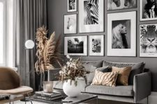 a black and white gallery wall with matching frames and black and white prints looks chic and elegant