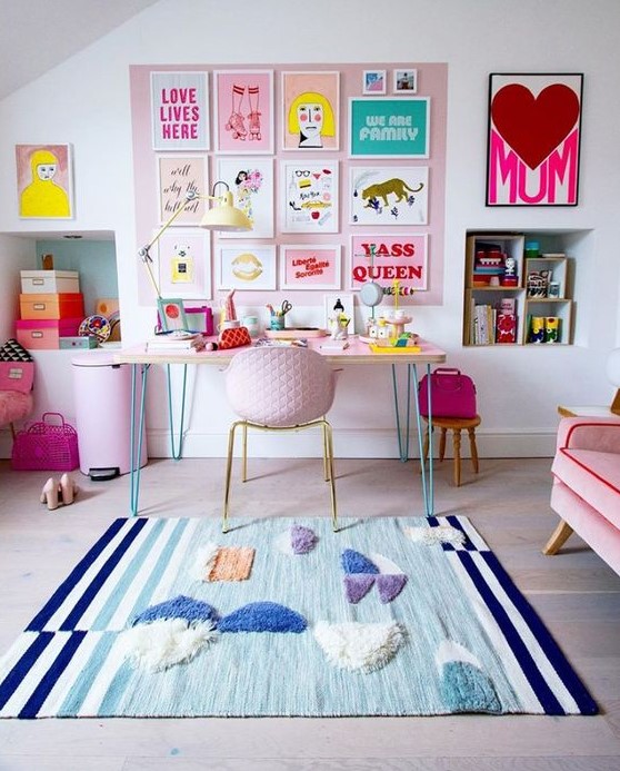 a bright and fun gallery wall on a pink part of wall, bright artworks, posters and signs is a gorgeous and glam idea