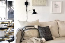 a chic neutral home accented with black touches and with a catchy 3 piece gallery wall that adds chic to the space