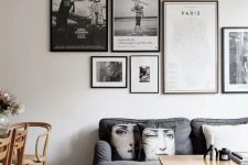 an exquisite gallery wall with mismatching black frames and black and white artworks is a very chic idea to rock