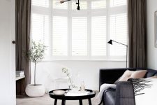 a lovely bow window with blinds