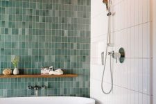 a bold contemproary bathroom with skinny white and mismatching green skinny tiles plus a grey mosaic tile floor