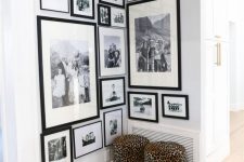 a large corner gallery wall of black and white family photos in matching black frames is a good idea to style an awkward nook